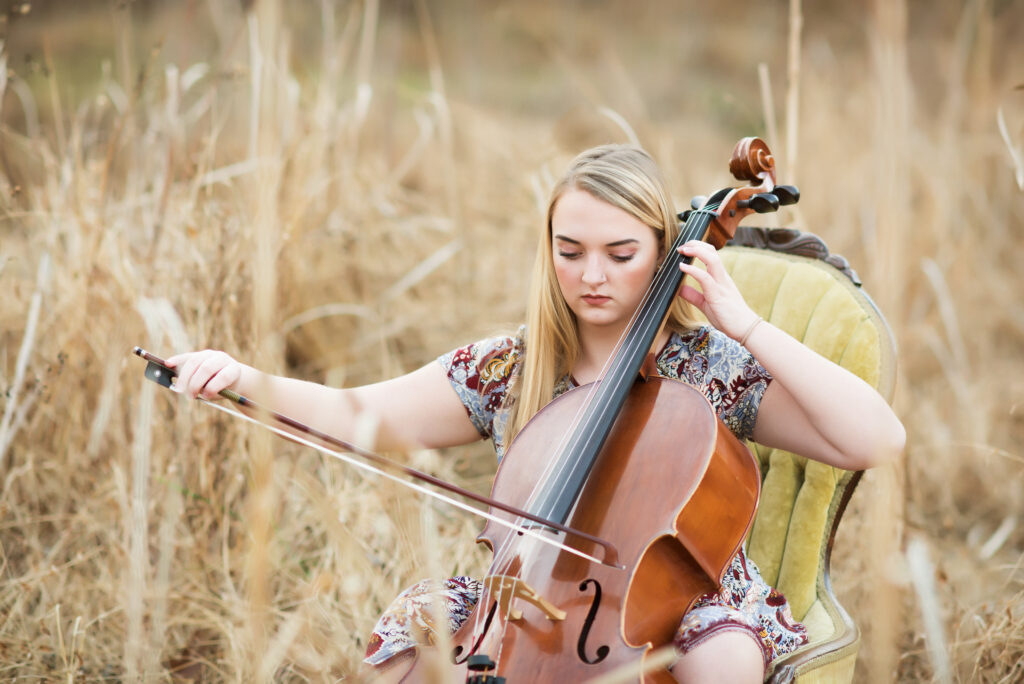 high school senior photography, girl with double bass in field